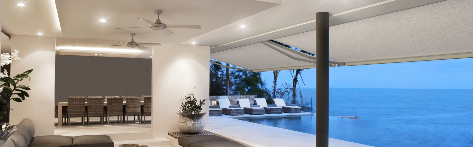 Luxury Home With Infinity Pool At Dusk.