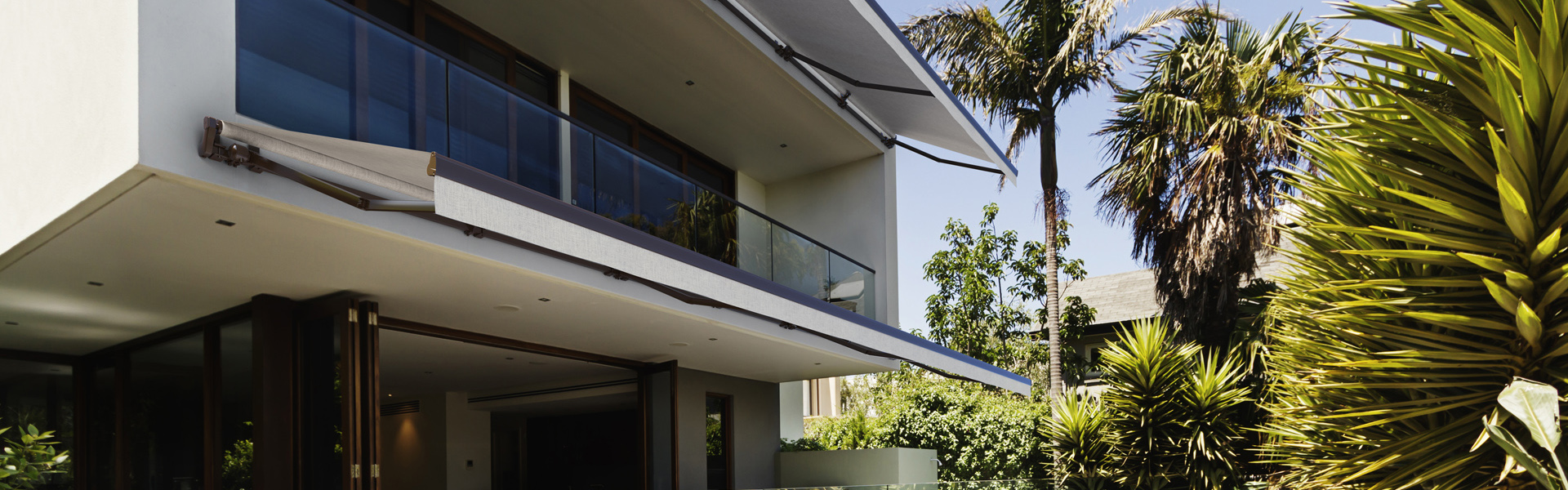 Rear garden of a contemporary Australian home with tiled swimming pool